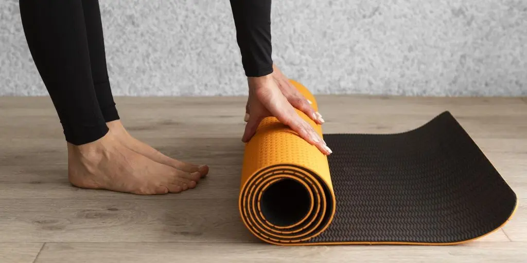 close-up-hands-holding-mat.jpg